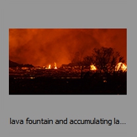 lava fountain and accumulating lava at night